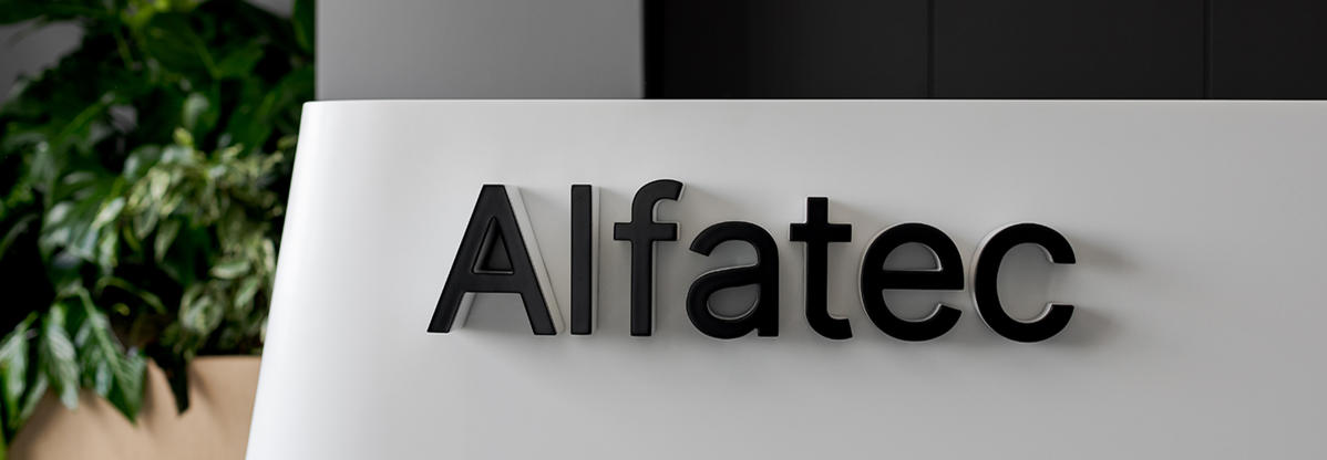 Alfatec sign on a desk