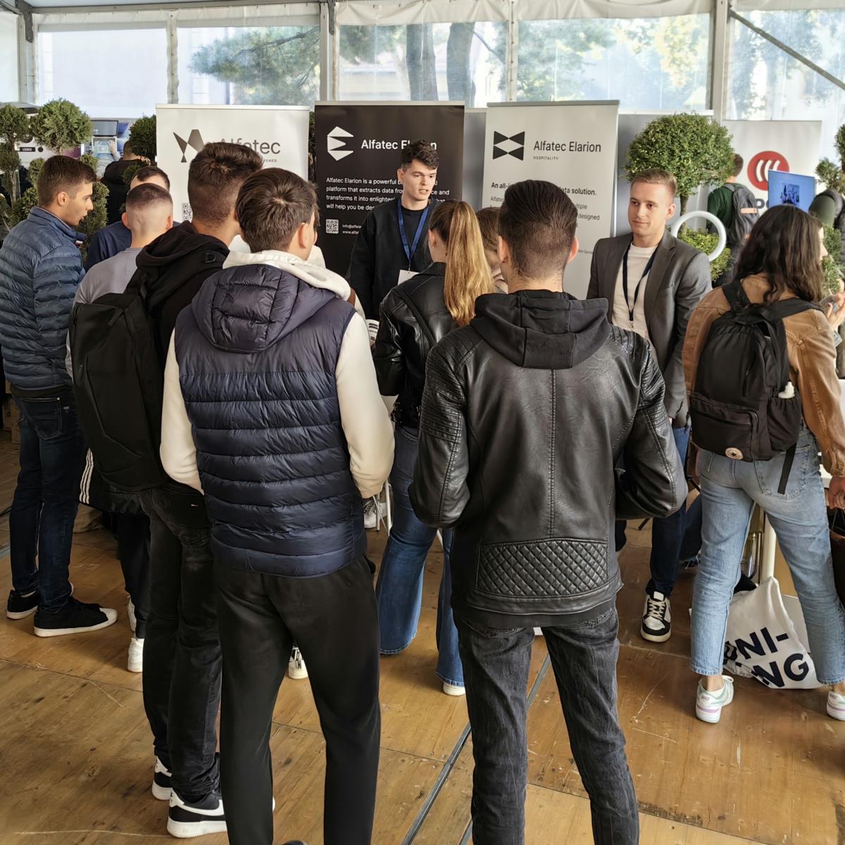 people looking at business stand