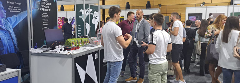 People standing at the stand, Business woman and three businessman. Careers Day, fair