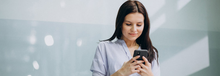 Young business woman on mobile