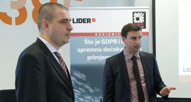 Two business people standing at conference